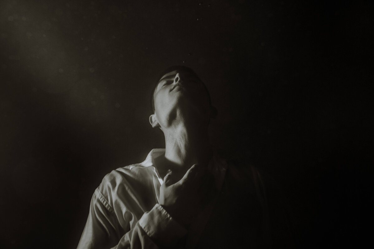 black and white portrait of man underwater