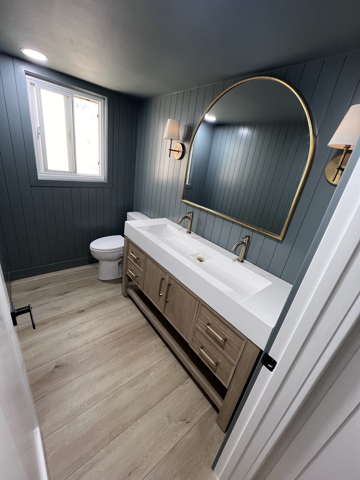 modern-blue-bathroom-double-vanity-wood-flooring-aw-development