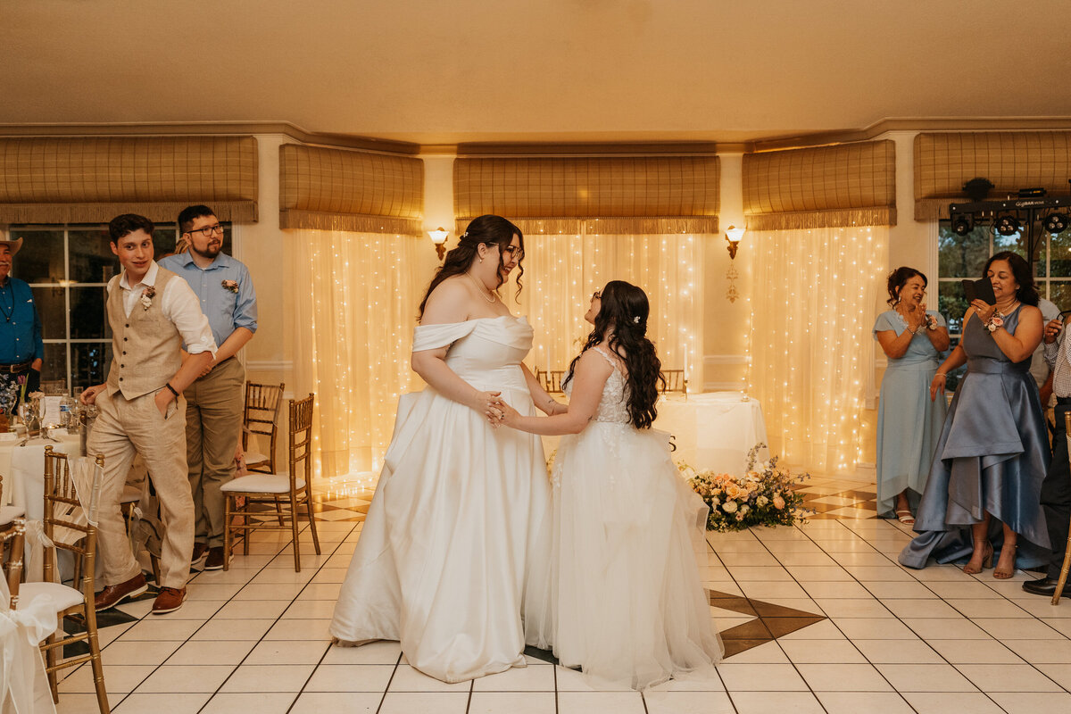 A newlywed couple dancing during their wedding reception 