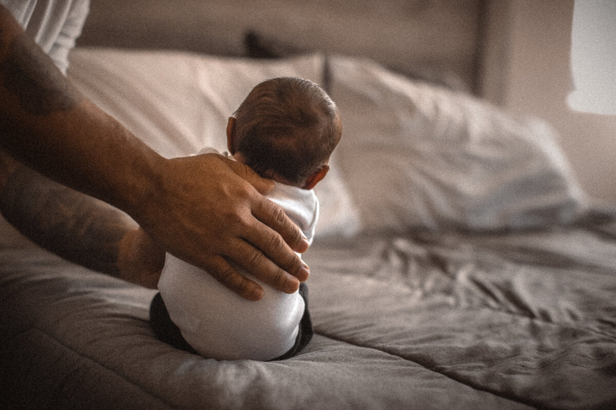 father holding newborn baby