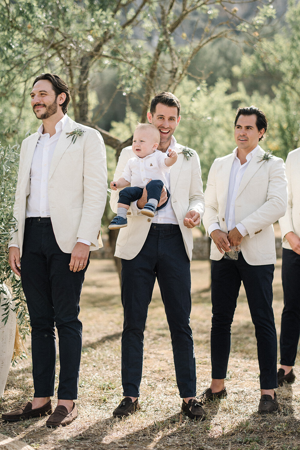 groomsmen in beige linen suits at finca wedding  mallorca