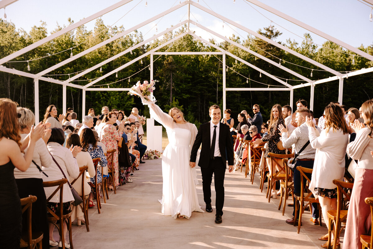 Bride and groom recessional at wedding ceremony June wedding at the Grand Ivory near Moncton, New Brunswick
