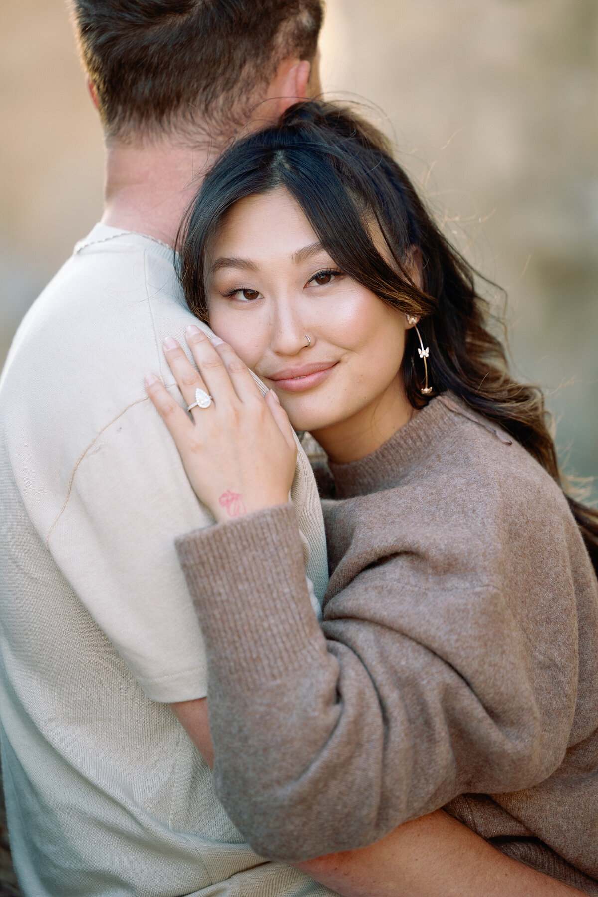 A person hugging their partner and smiling