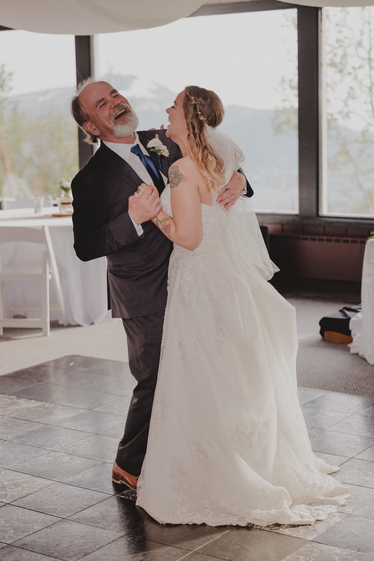 A father and bride share a dance