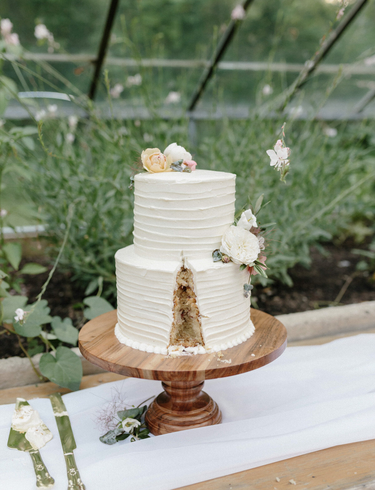 aftermath of cut wedding cake, film wedding photographer in west Michigan, Glass House community