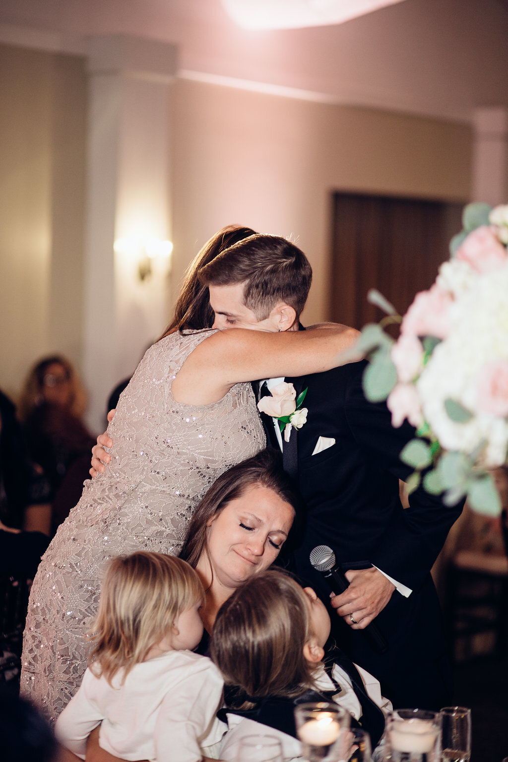Wedding Photograph Of Groom Hugging a Woman Los Angeles