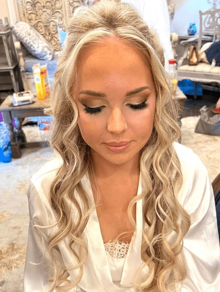 Bride with soft curls and airbrush makeup, captured after wedding day hair and makeup by Mistique Makeup in San Antonio
