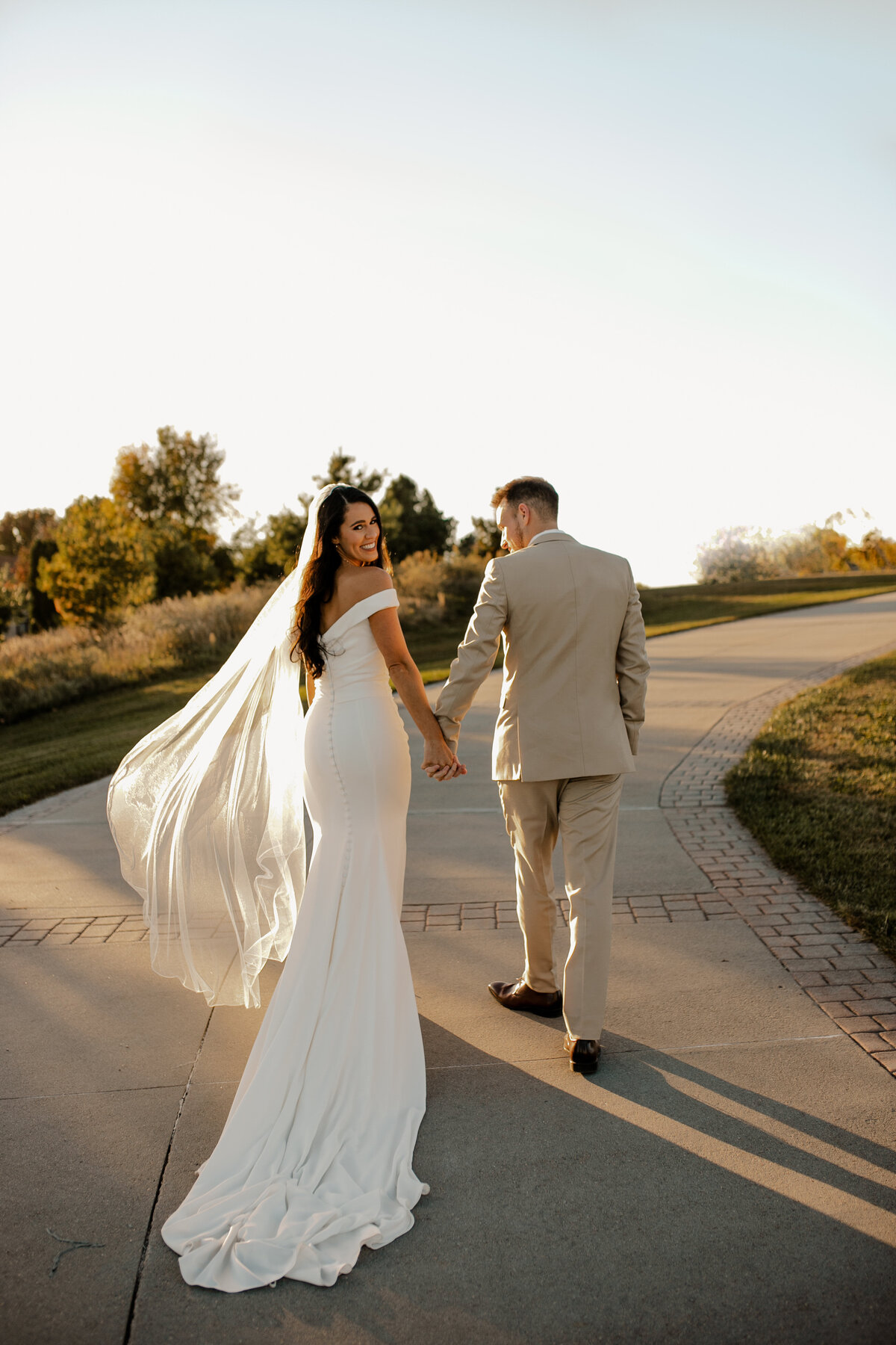 Elegant Bella Terre Vineyard wedding near Omaha, NE, blending luxury and rustic charm. Bride and groom celebrate amidst picturesque vineyard views and timeless architecture, captured by Tori Nichole Photography. A stunning setting for couples seeking a unique and sophisticated venue in the Omaha and Iowa region.