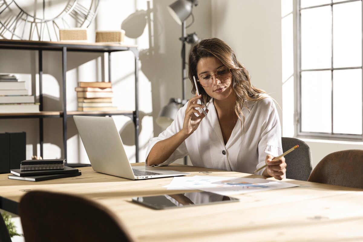 a small business owner working in her home office