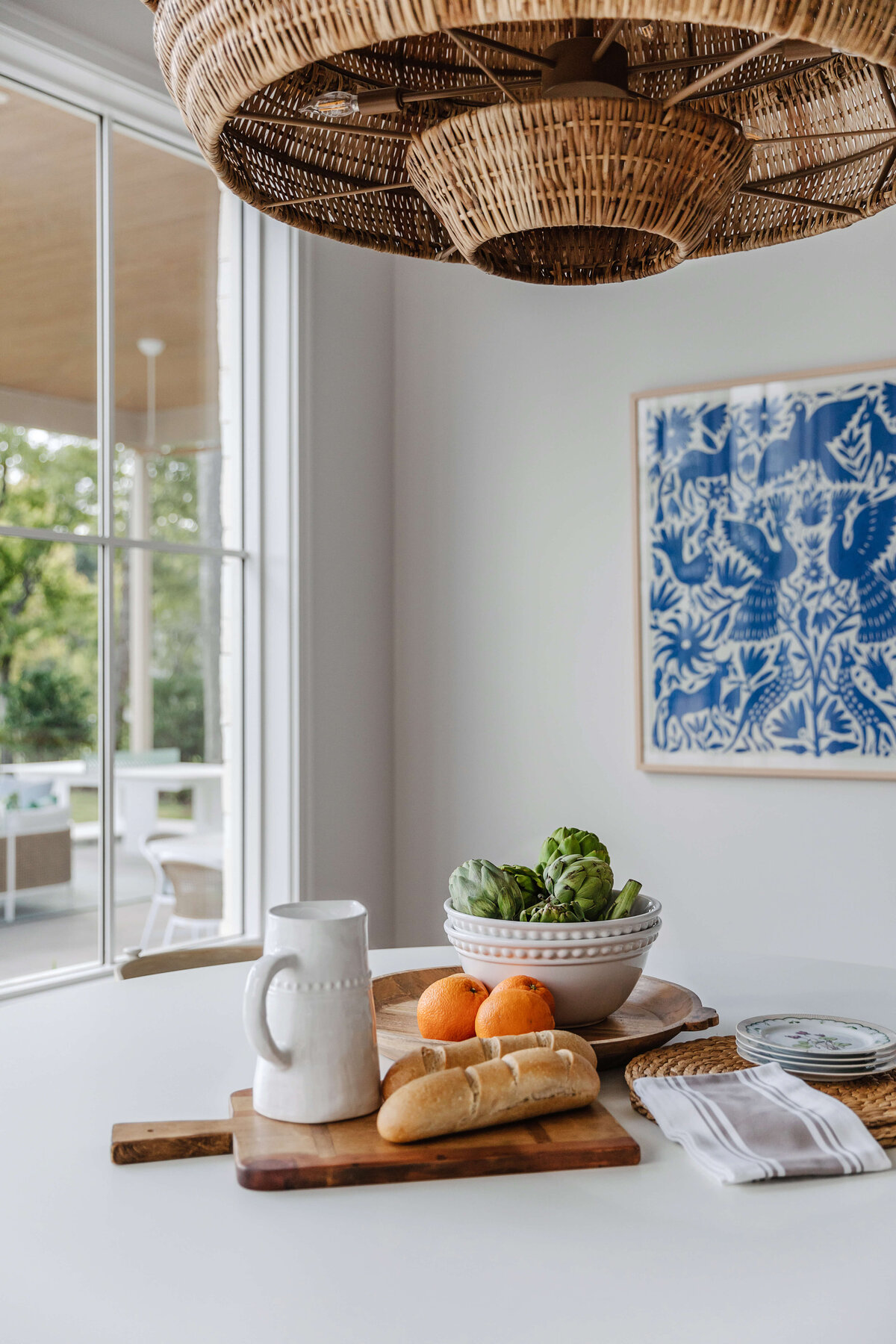 oyster creek studios memorial new build wicker light with blue china pattern artwork in kitchen