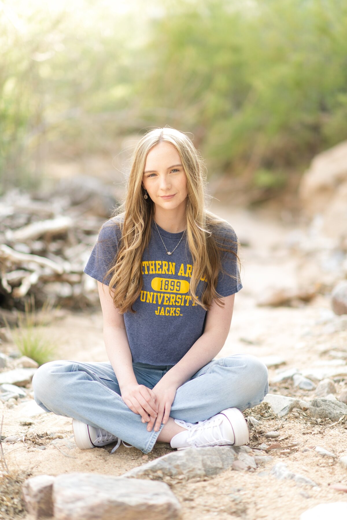 Senior Girl posing for senior photos at dc ranch marketstreet in scottsdale az