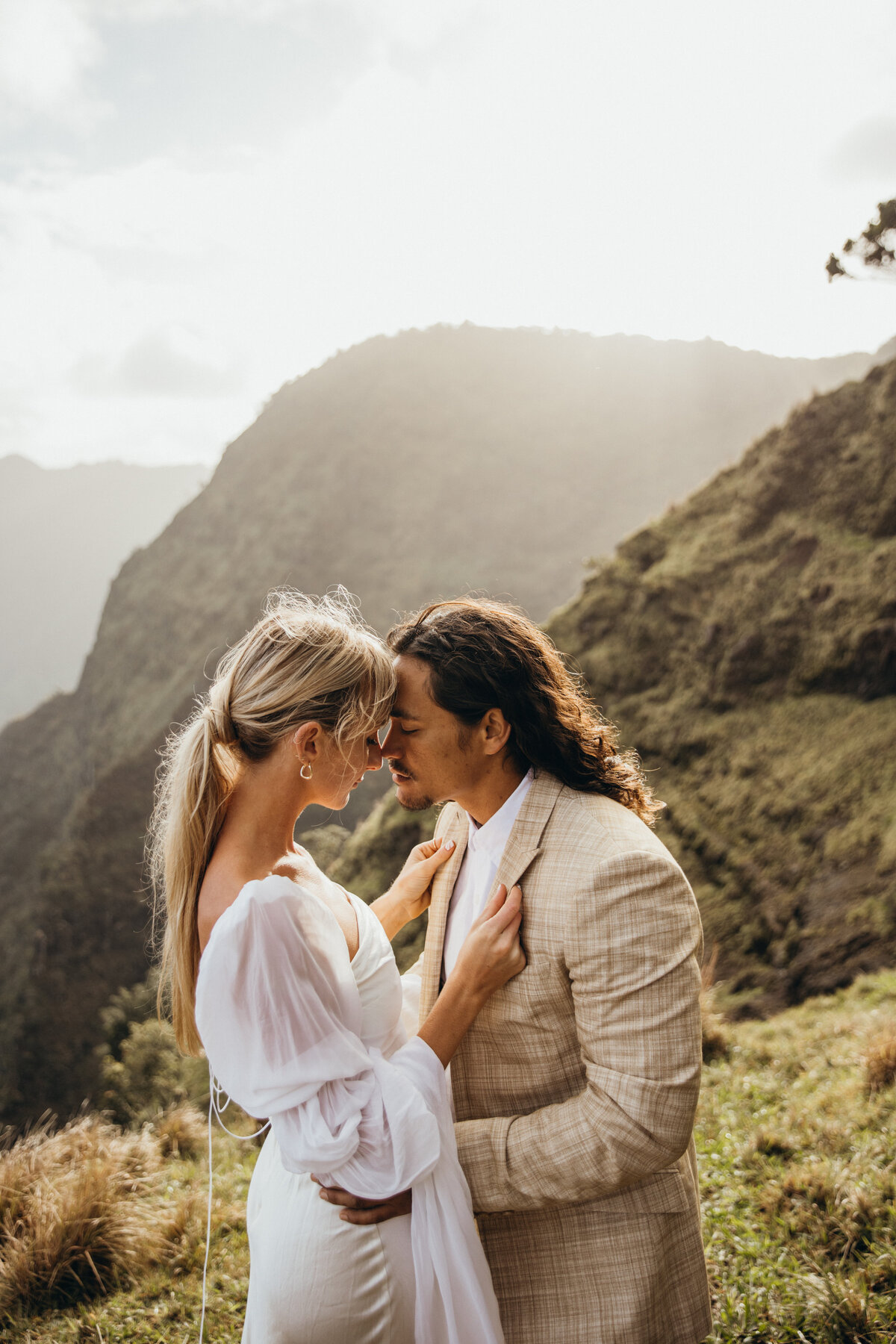 Maui Wedding Photographer captures bride holding groom's jacket lapels