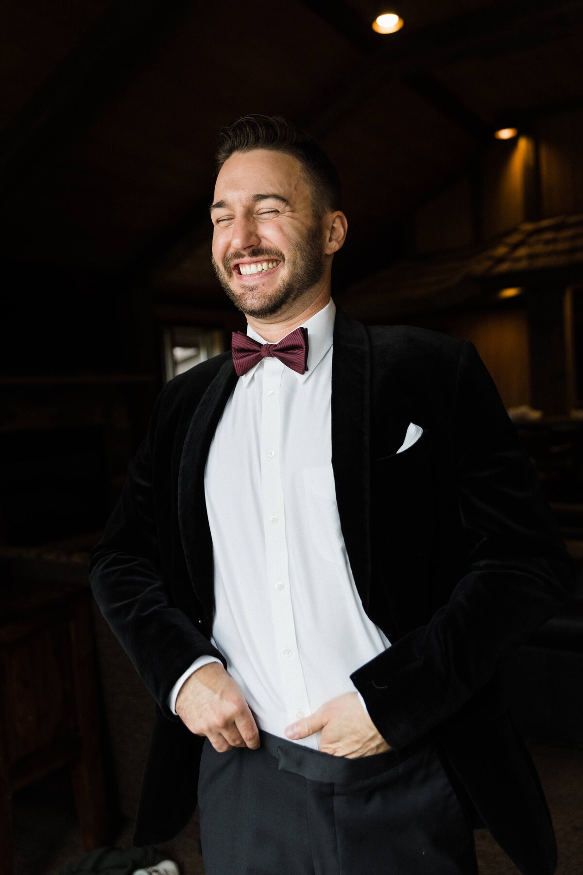 Groom smiles before his ceremony on his wedding day.