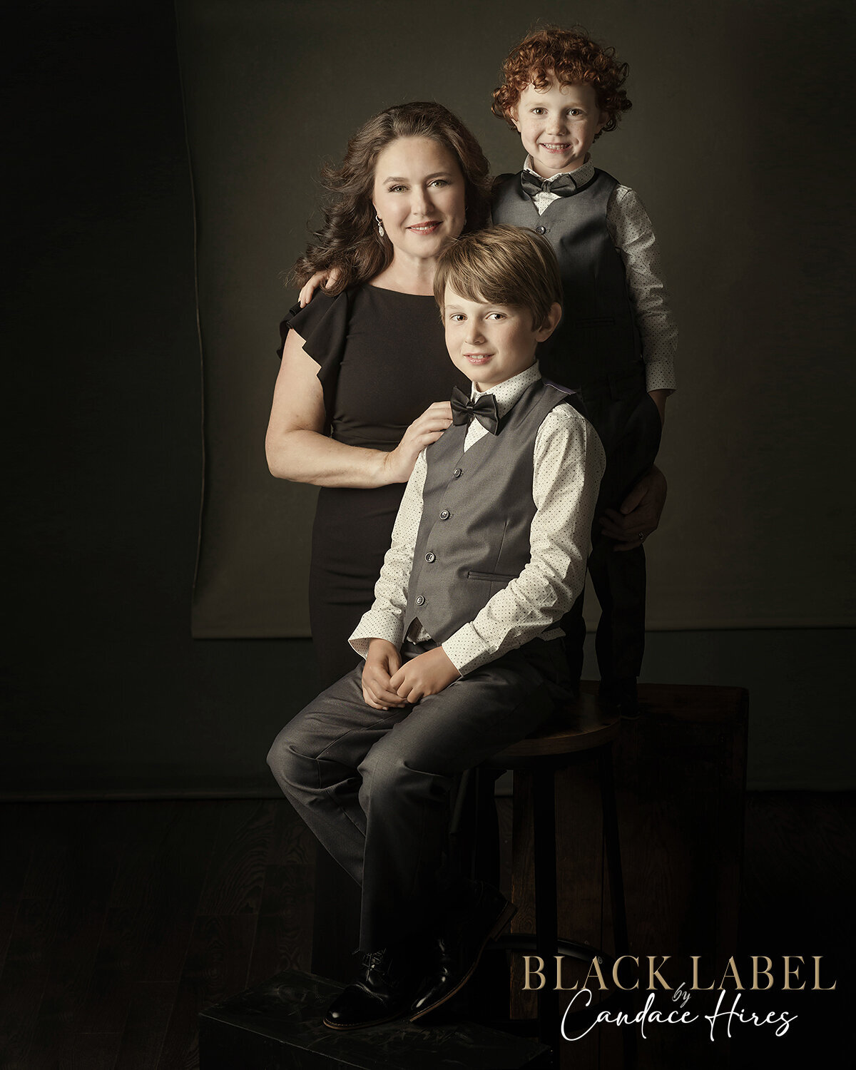 mother photographed with two sons in a sutdio in st simons island