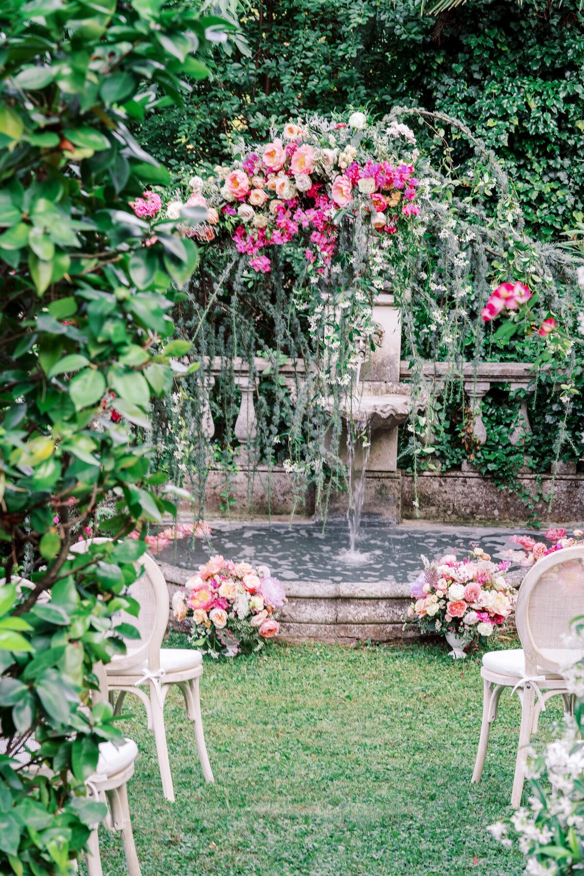 Ceremony in front of fountain, surrounded by jasmine and flowers photographed by Lake Como Wedding photographer