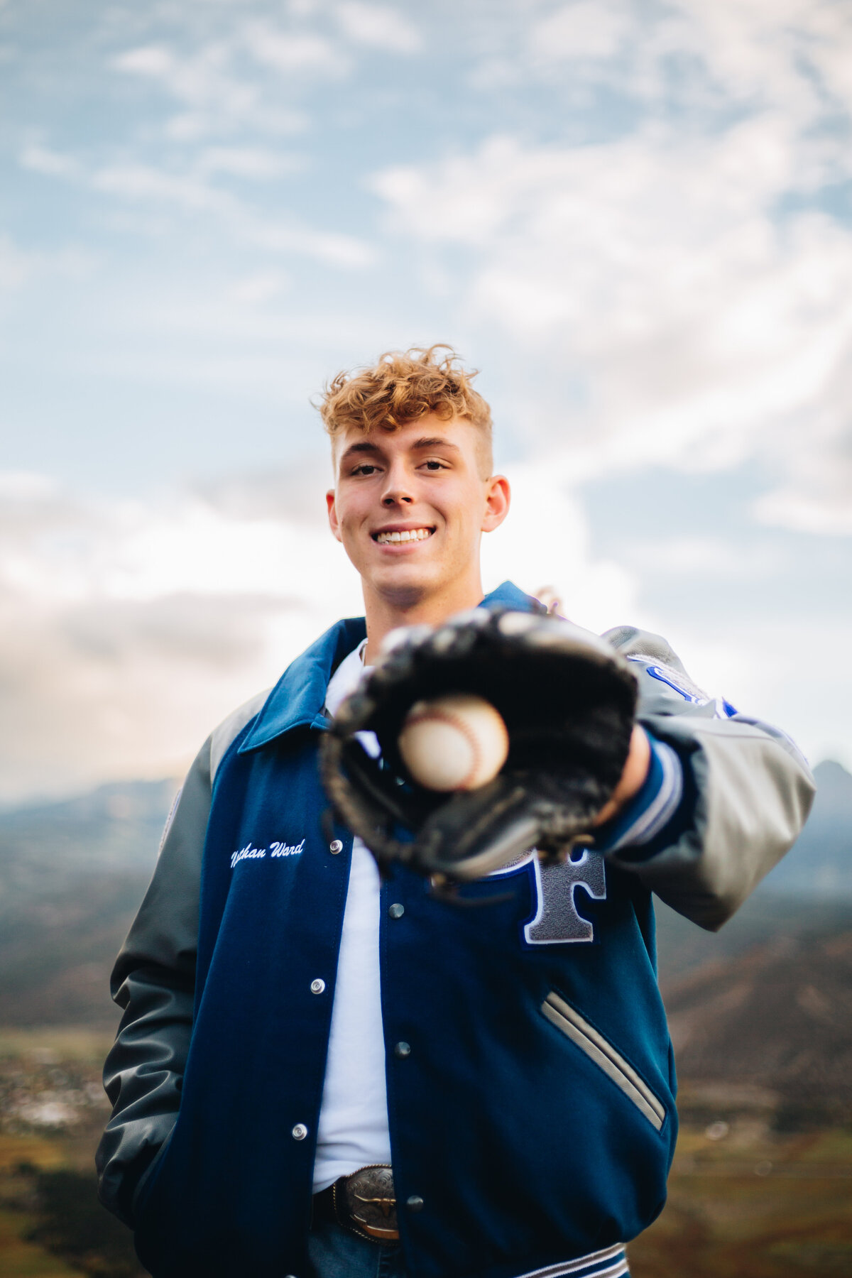 Kyle poses with his baseball for his Montrose senior pictures.