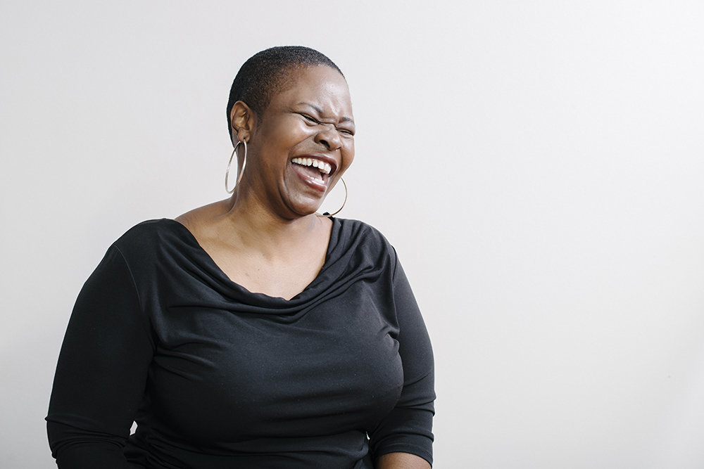 Relaxed and Casual Laughing Headshot of beautiful black woman