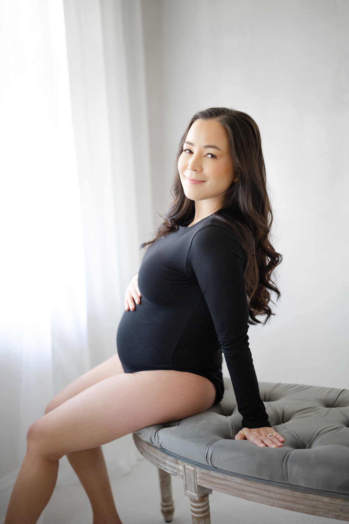 Elegant maternity portrait of Lori and Christina in Tampa natural light studio