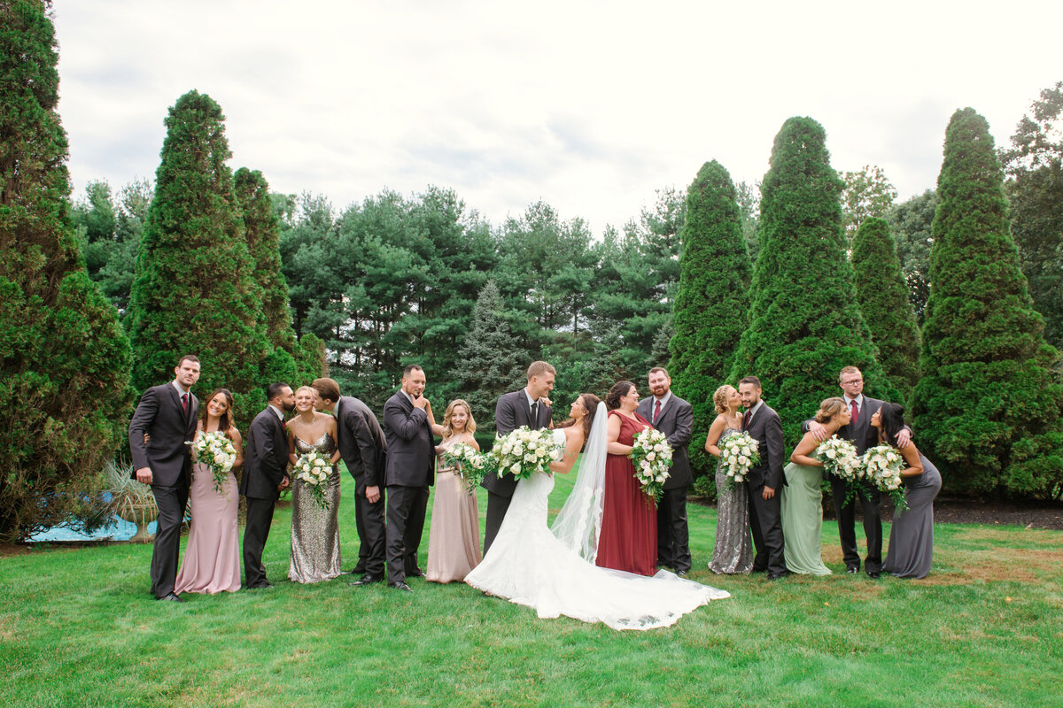 photo of bridal party with bride and groom outdoors from wedding at The Carltun