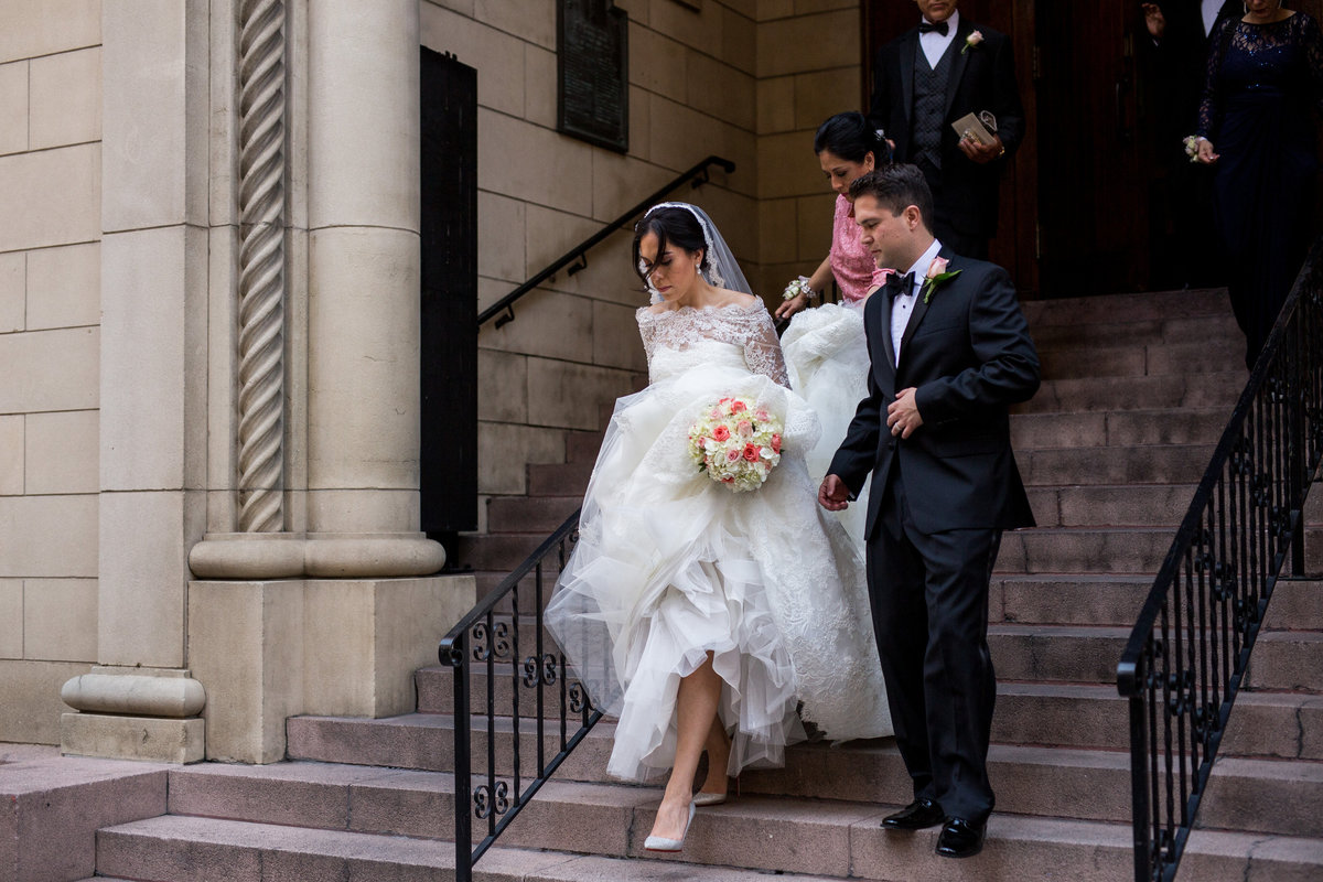 wedding couple exiting St Mary's Catholic Church in downtown San Antonio