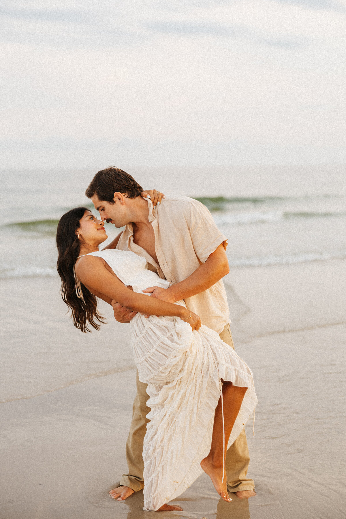 couple kissing on beach