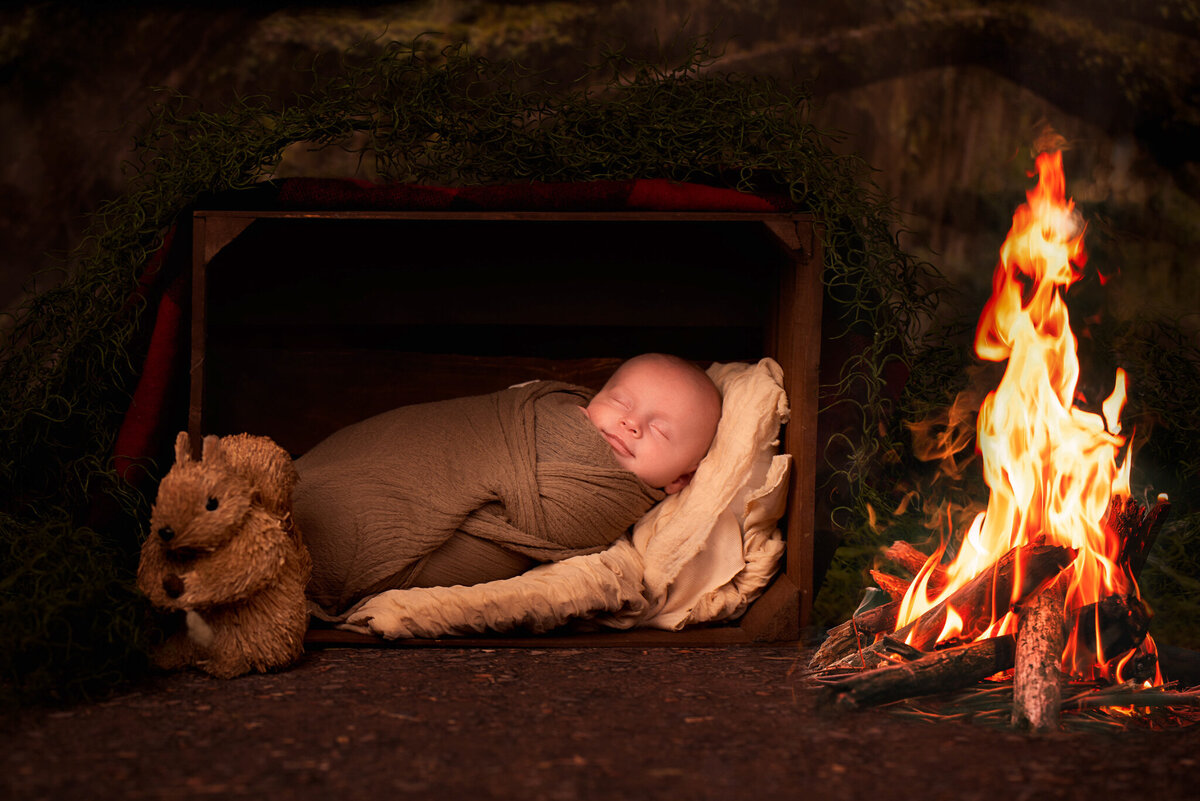 Festive newborn portrait with a cozy Christmas fireplace backdrop, captured in Overland Park, Kansas. Ideal for families looking for holiday-themed newborn photography in the Kansas City