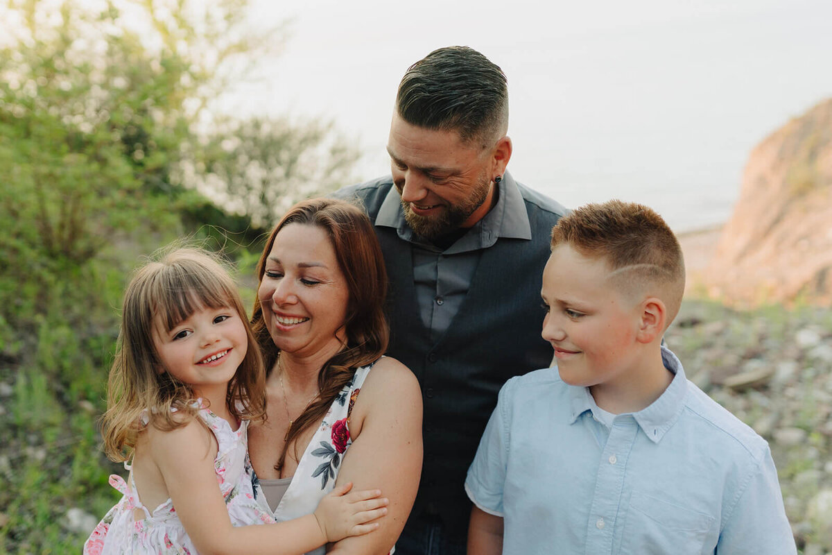 family with two kids on the beach at family photo shoot in Finger Lakes, NY