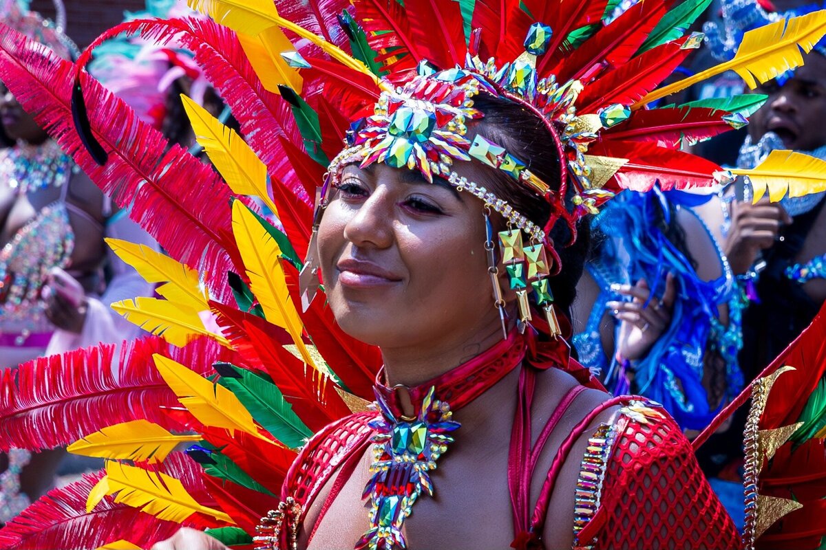 Toronto caribbean carnival parade masquerader in costume with Sunlime Mas, the number 1 medium size band at Toronto Carnival.