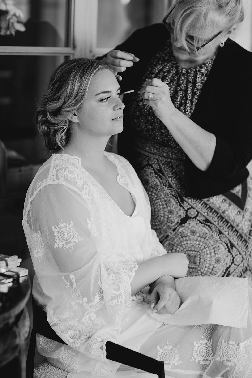 Bride getting makeup done