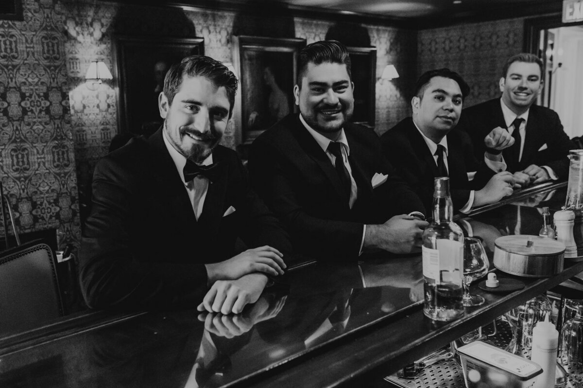 Black and white photo of men wearing suits