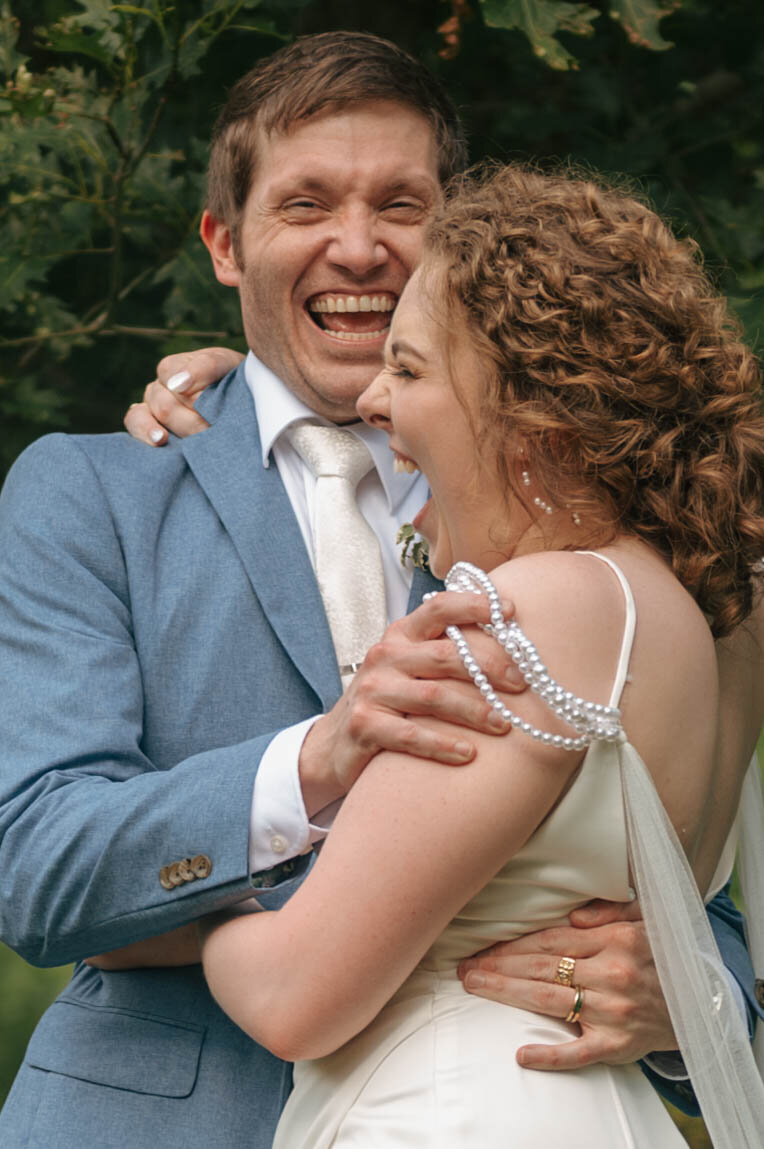Bride and groom portraits, outside in June at the Groesbeck Estate