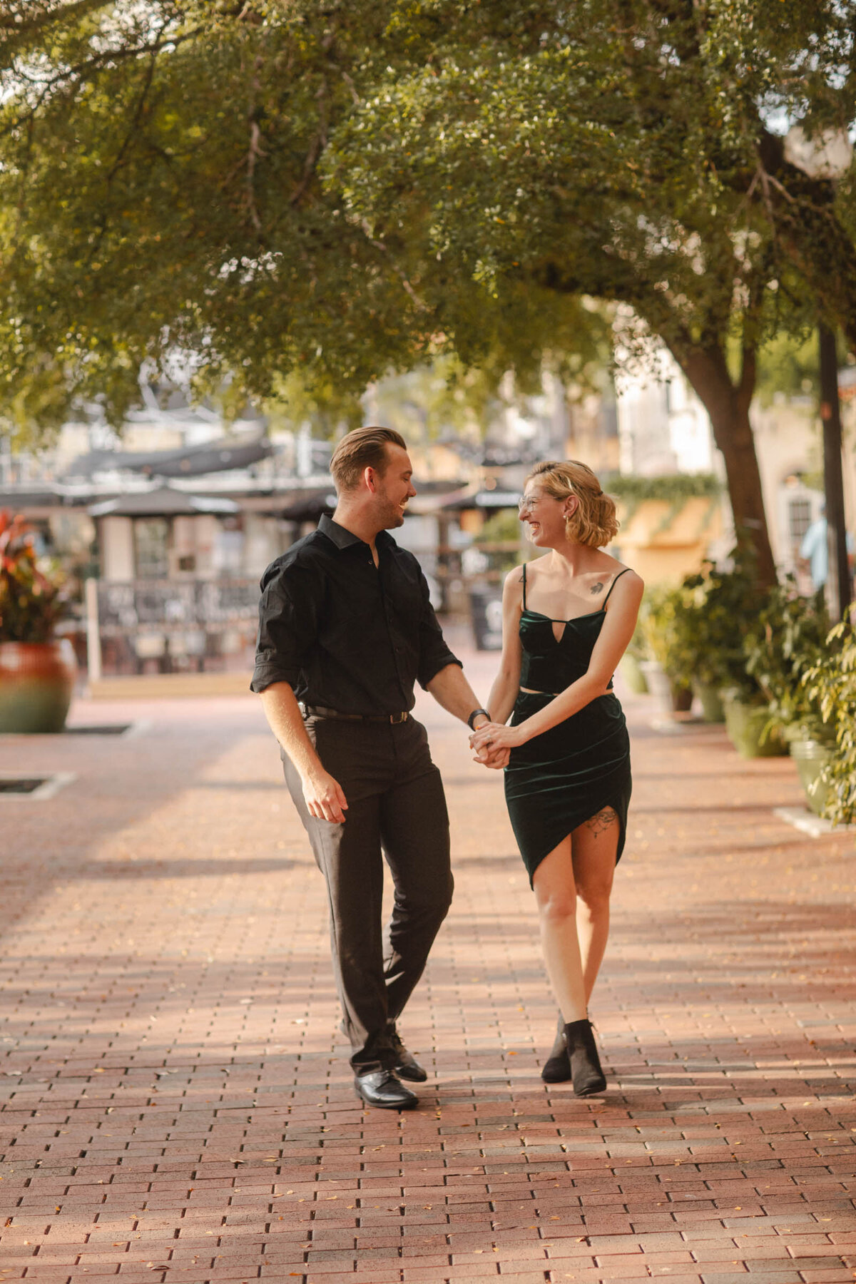 This image is of a couple posing for a portrait in downtown fort myers.
