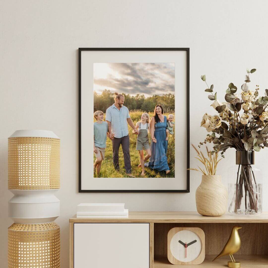 Mockup of family portrait hanging over credenza in home