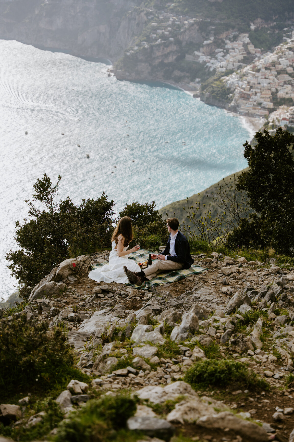Couple having a picnic above the Amalfi Coast.