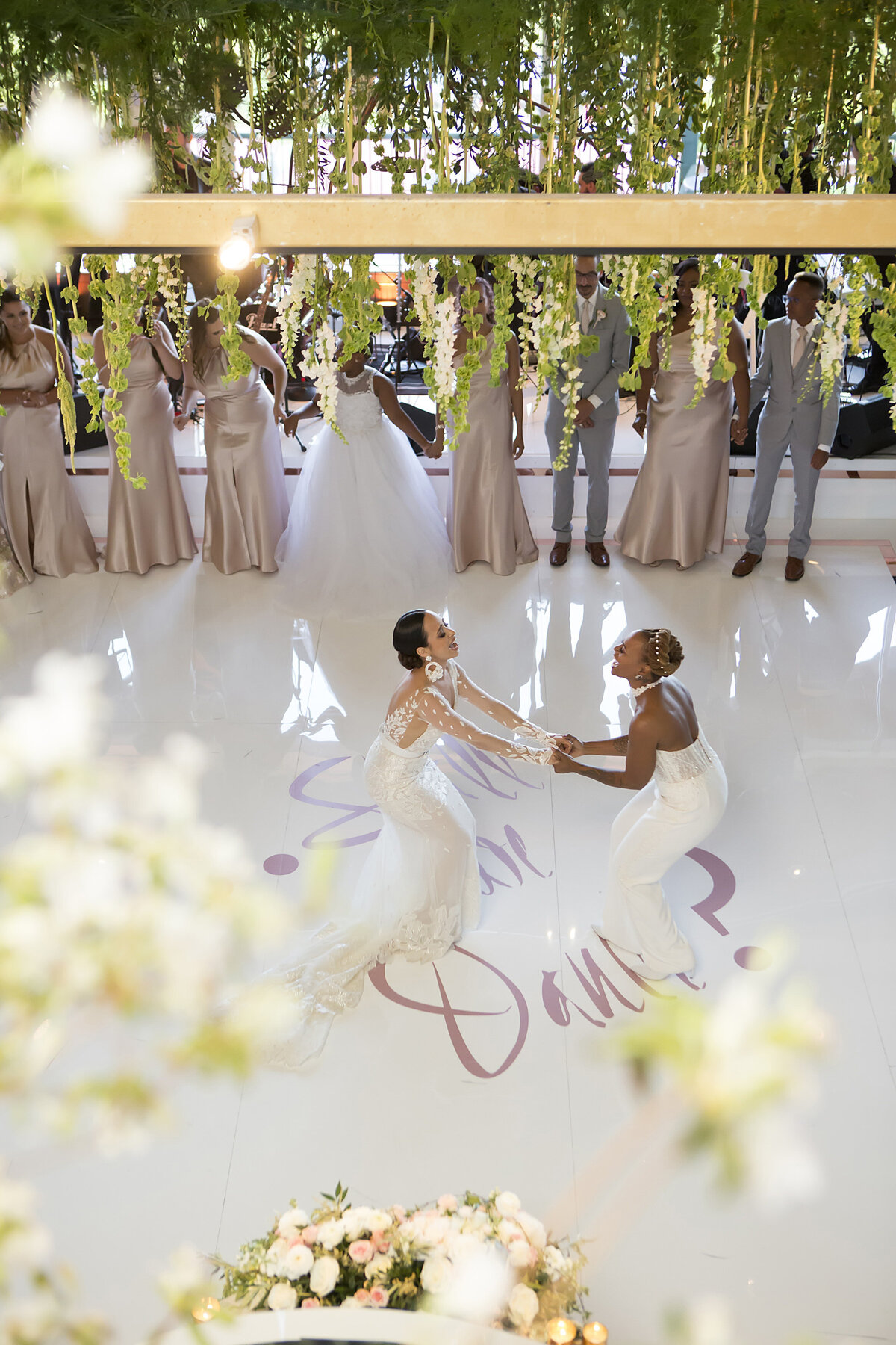 A view looking down at two people dancing at a wedding reception 