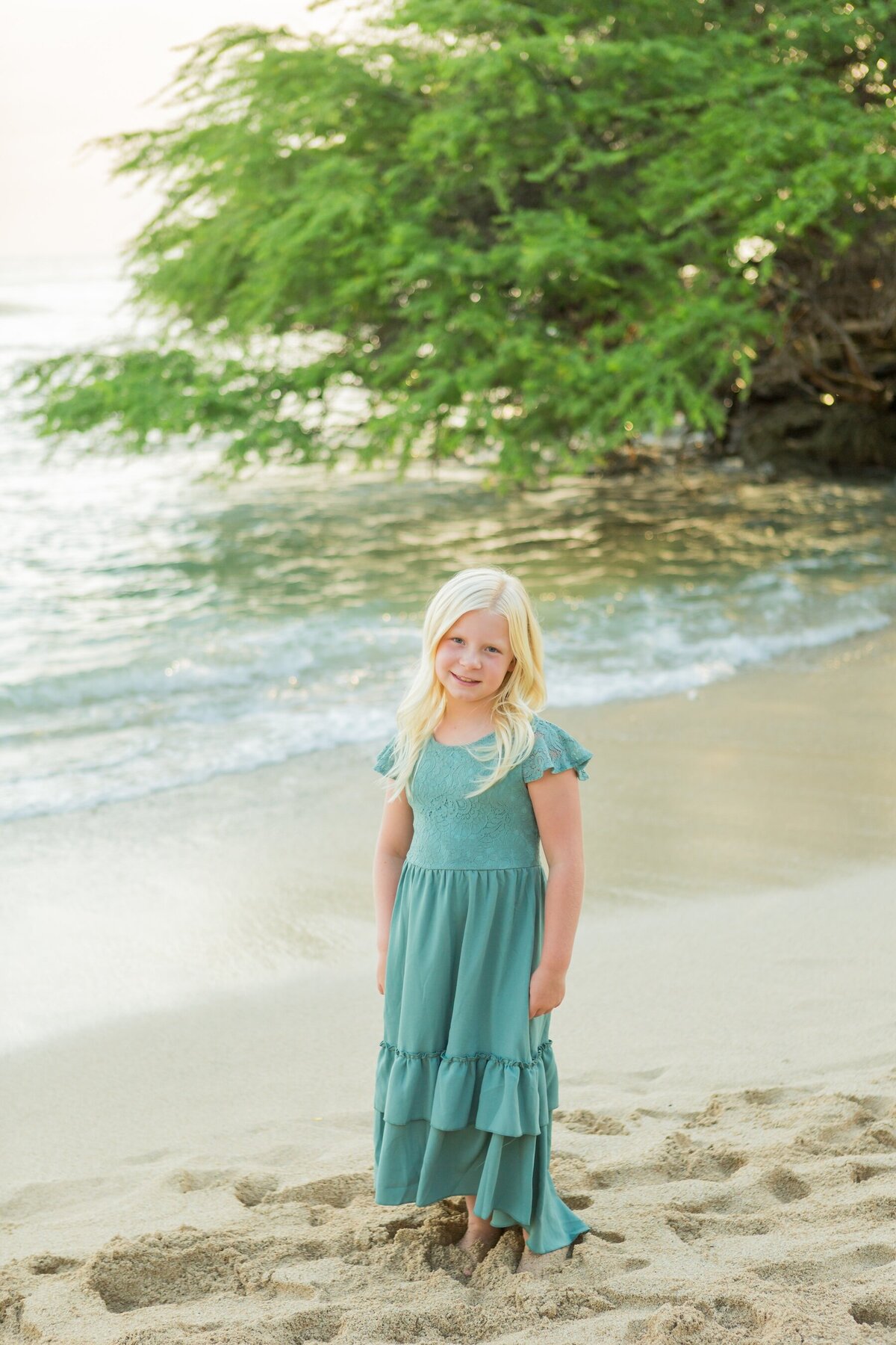 Oahu Family Photo of little girl on the beach in a green dress