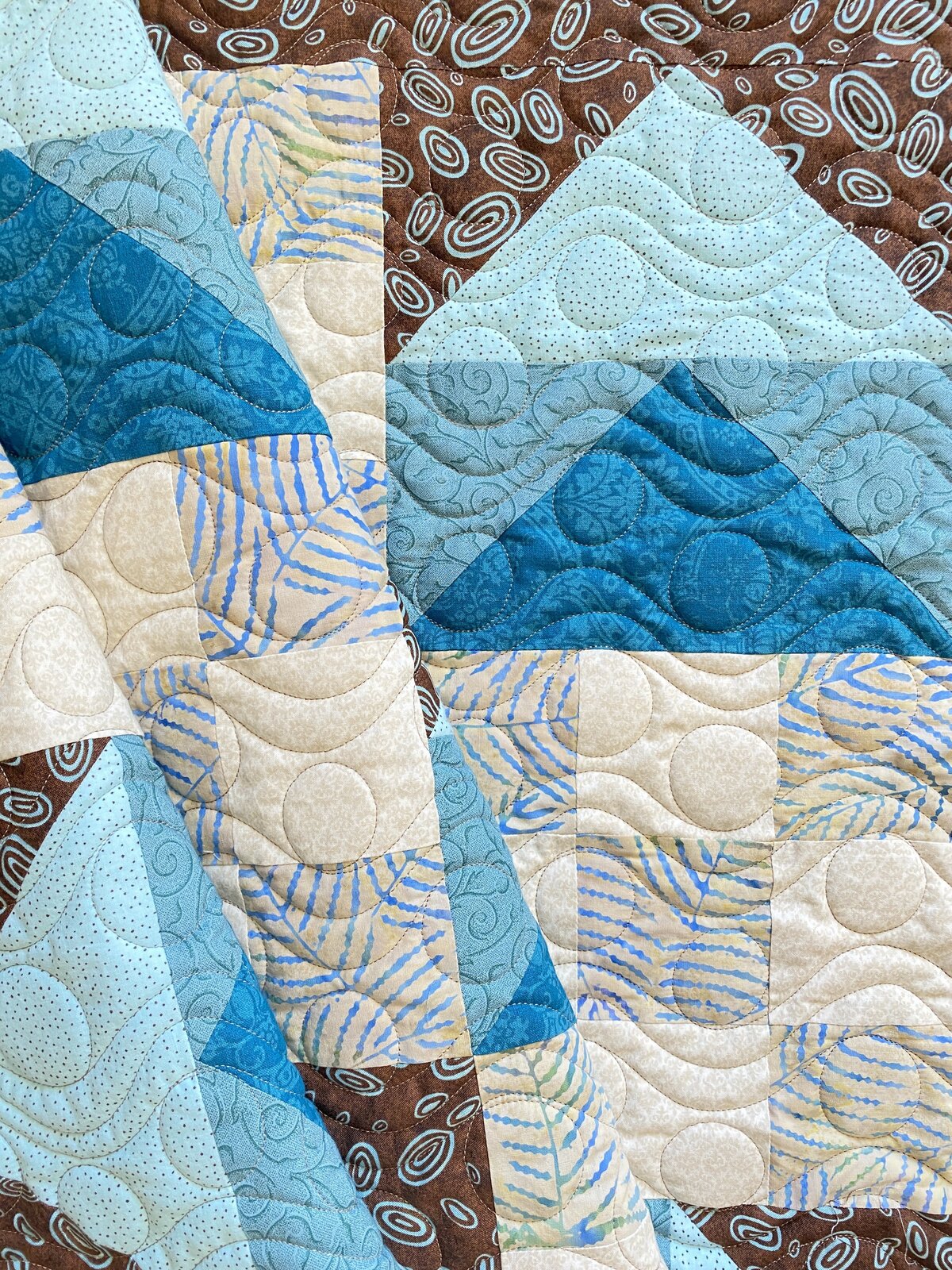 this blue and white quilt features the waves and bubbles quilting design