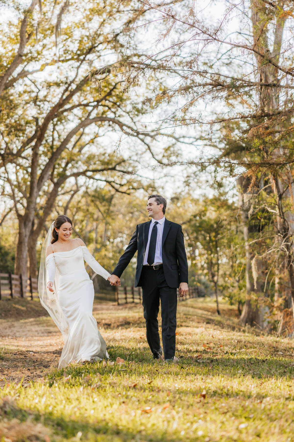 bride-and-groom-walk-on-a-ranch