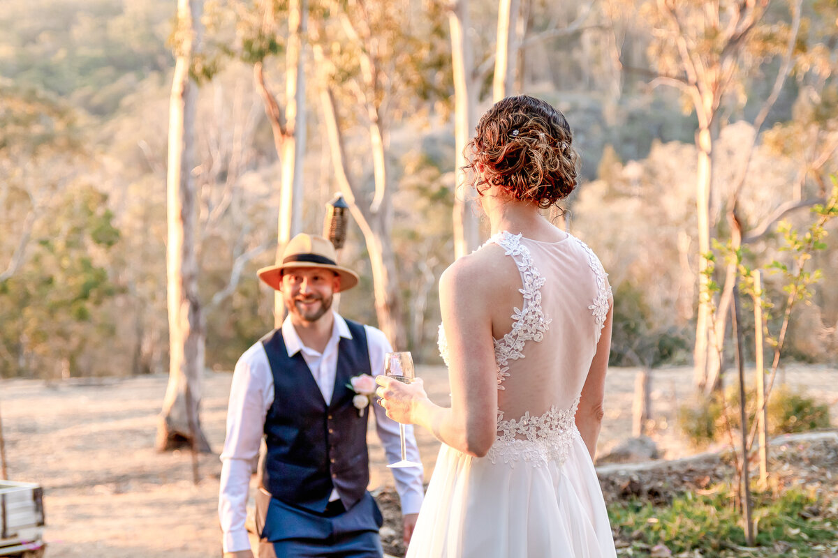 Grom walking towards bride