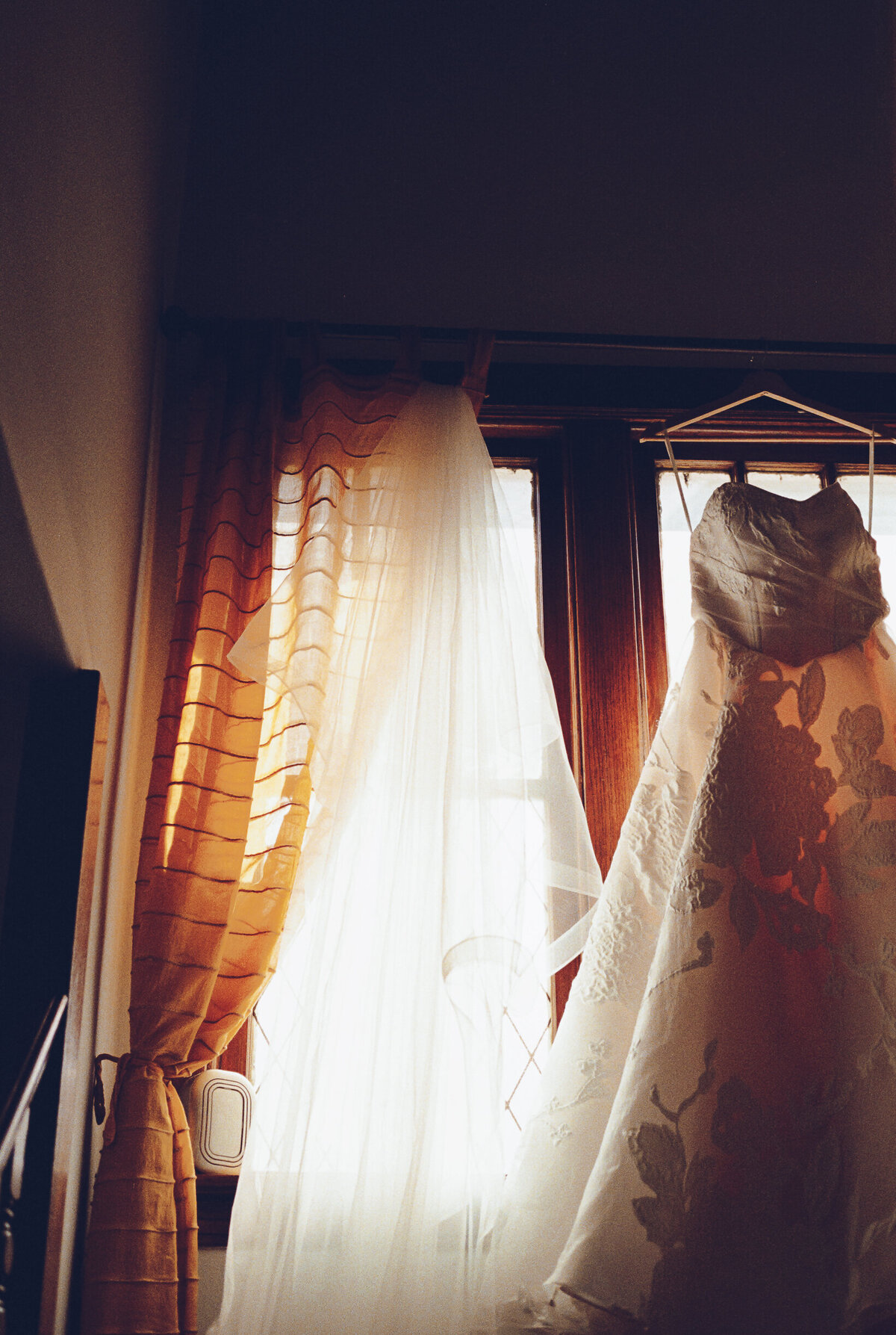 A couple gets ready at their home before their wedding at the Garfield Park Conservatory