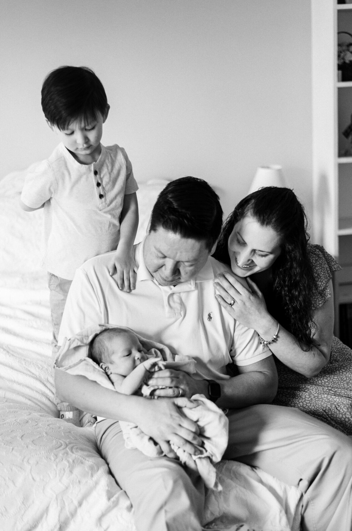 newborn and family black and white