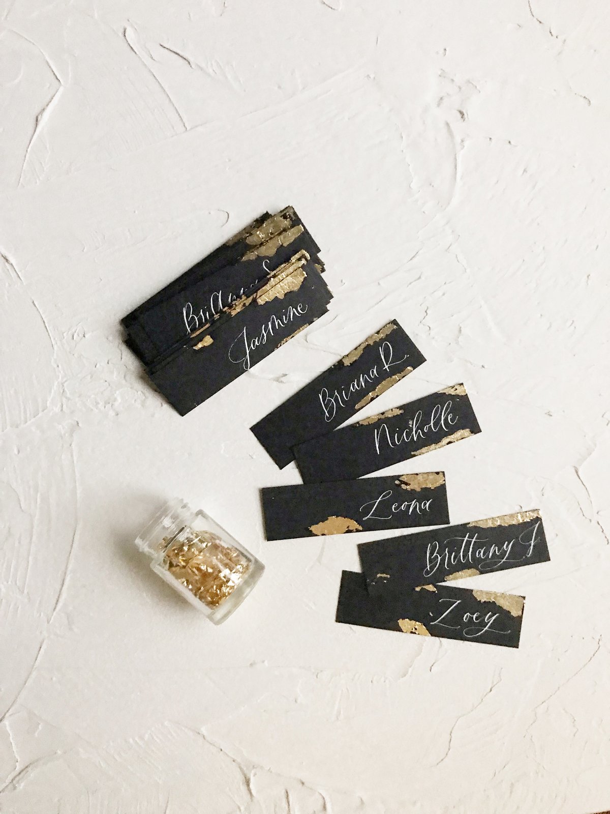 gold leaf place cards with calligraphy