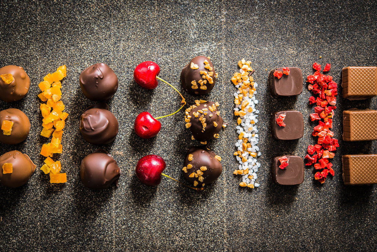 selection of handmade chocolates with cherries and freeze dried raspberry