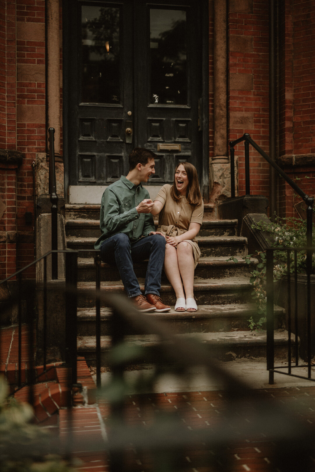 Earthy photo of couple sitting on doorstep | Jamie Tobin Photography