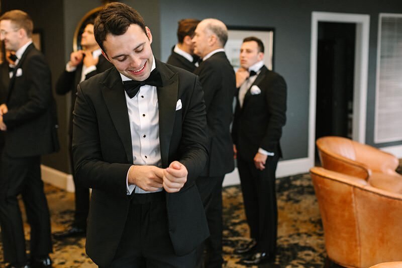 groom-buttoning-suit-jacket-evansville-country-club12