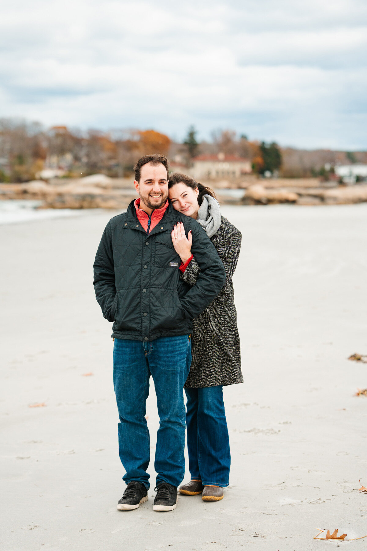 New England coastal proposal with candid surprise moment and natural storytelling.