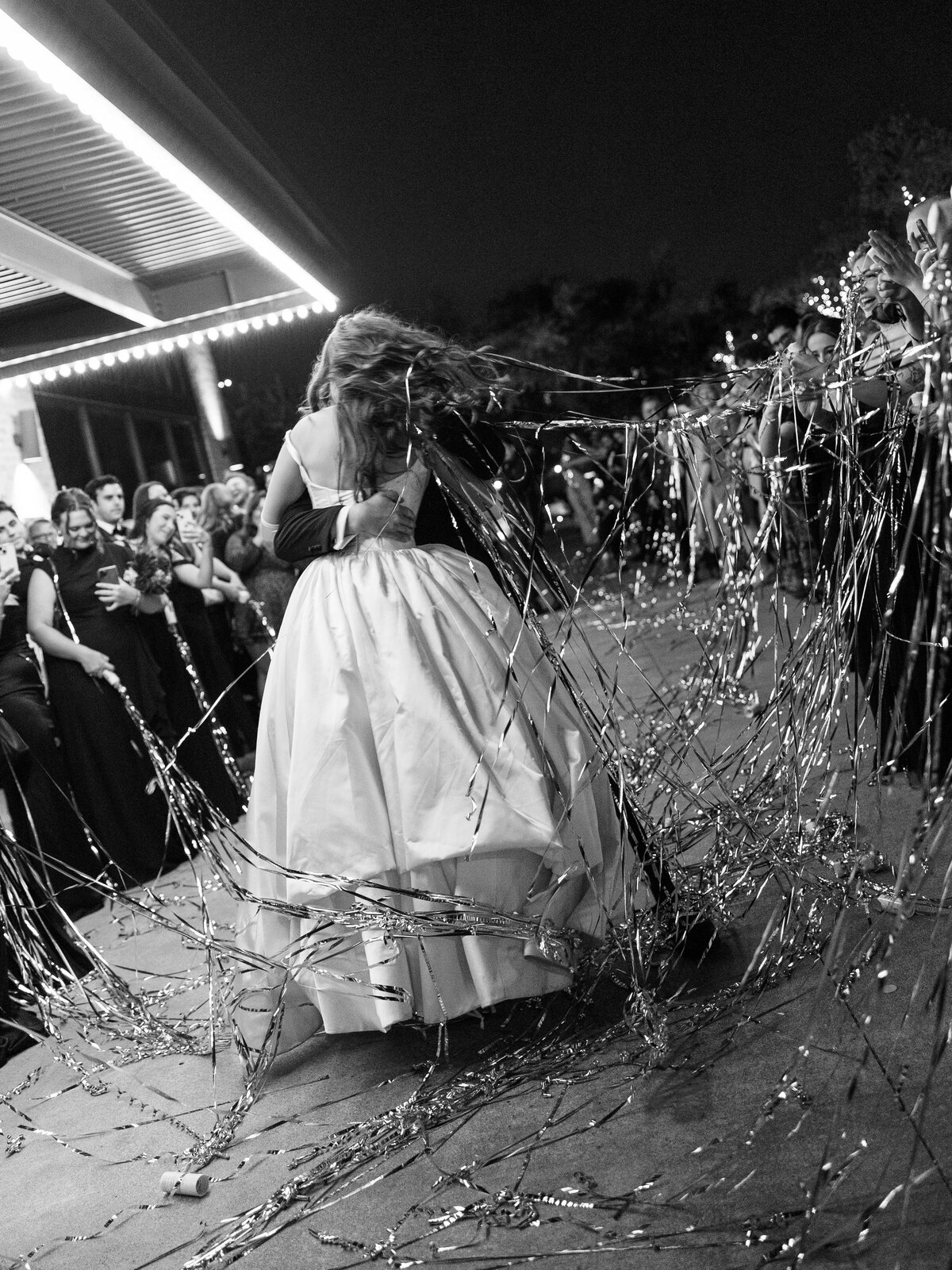 A photo of the bride and groom during the reception  at their Astorian wedding in Houston.