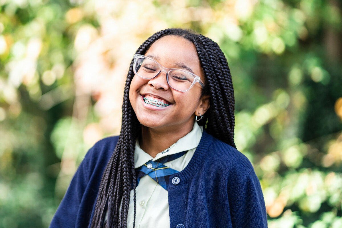 happy-girl-in-bue-sweater-school-portrait