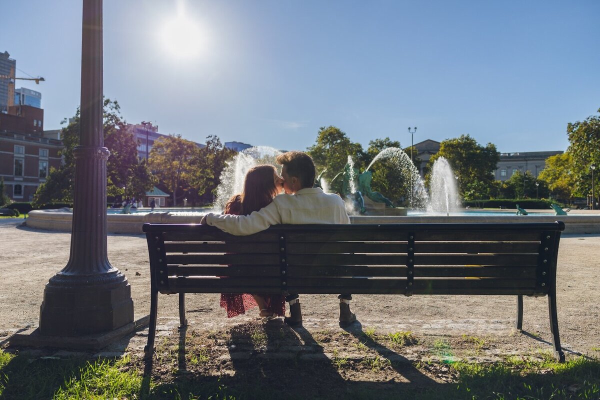  Couple cuddling on a bench in Philly.