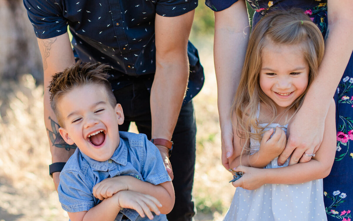kids laugh while being tickled